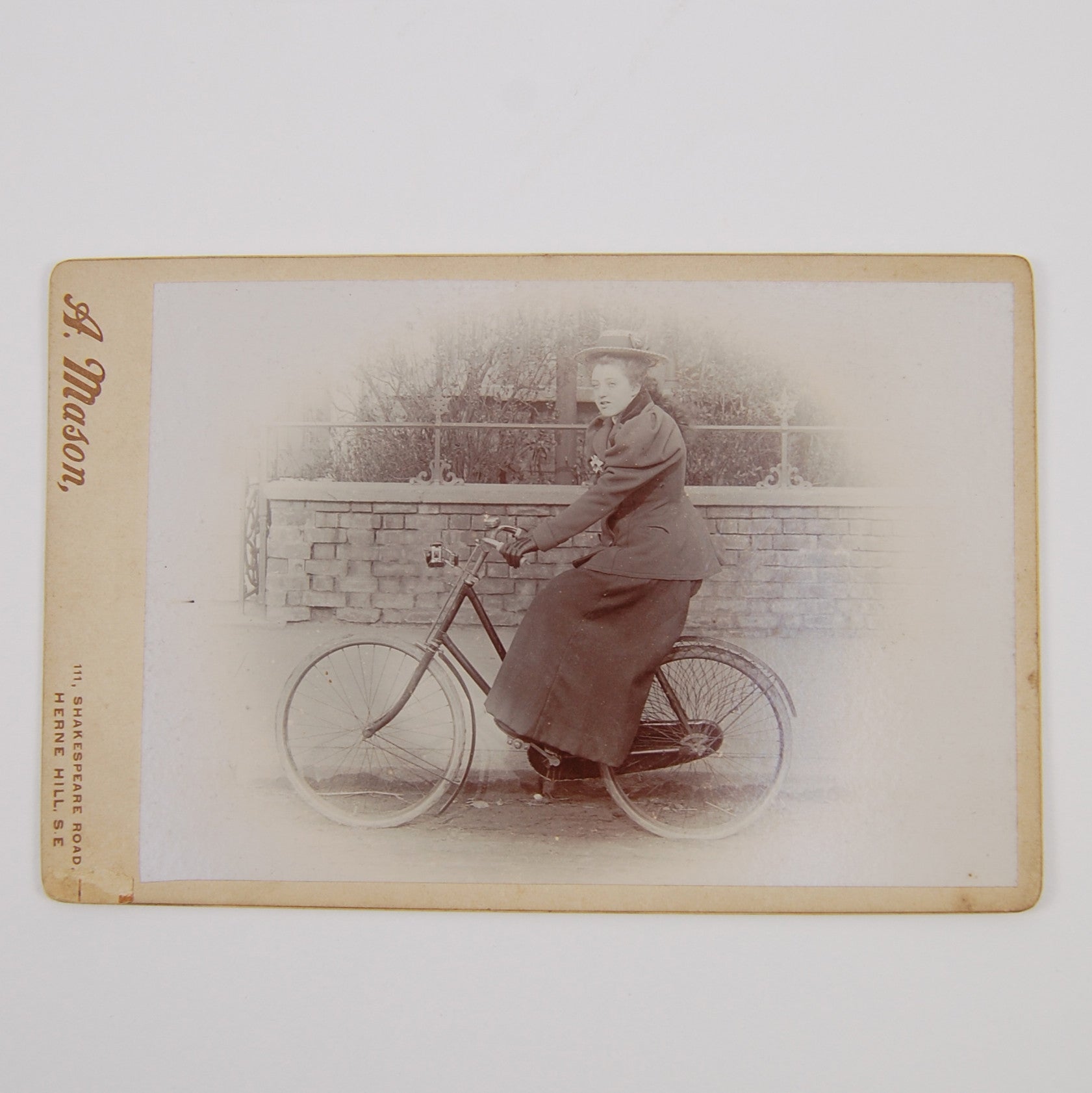 Mason, A. | Cabinet card depicting a female cyclist.